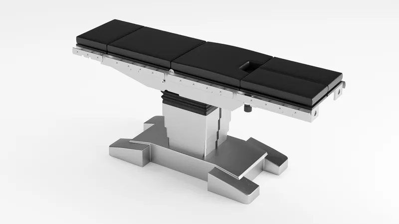 Surgical table with articulated sections rendered in 3D on a white studio background